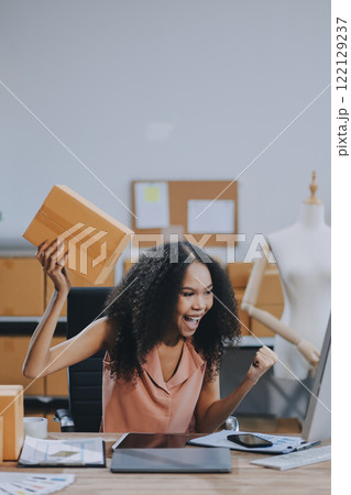 Portrait of Starting small businesses SME owners female entrepreneurs working on receipt box and check online orders to prepare to pack the boxes, sell to customers, SME business ideas online. 122129237