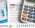 Tax Return form 1040 with pencil and calculator, U.S. Individual Income. 122446978