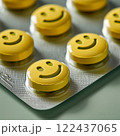 A group of yellow pills with smiling faces on them. happy concept 122437065