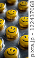 A group of yellow pills with smiling faces on them. happy concept 122437068