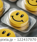 A yellow pill with a smiling face on it. happy concept 122437070