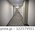 Modern Hotel Corridor with Recessed Lighting Eye-Level Perspective 122579501