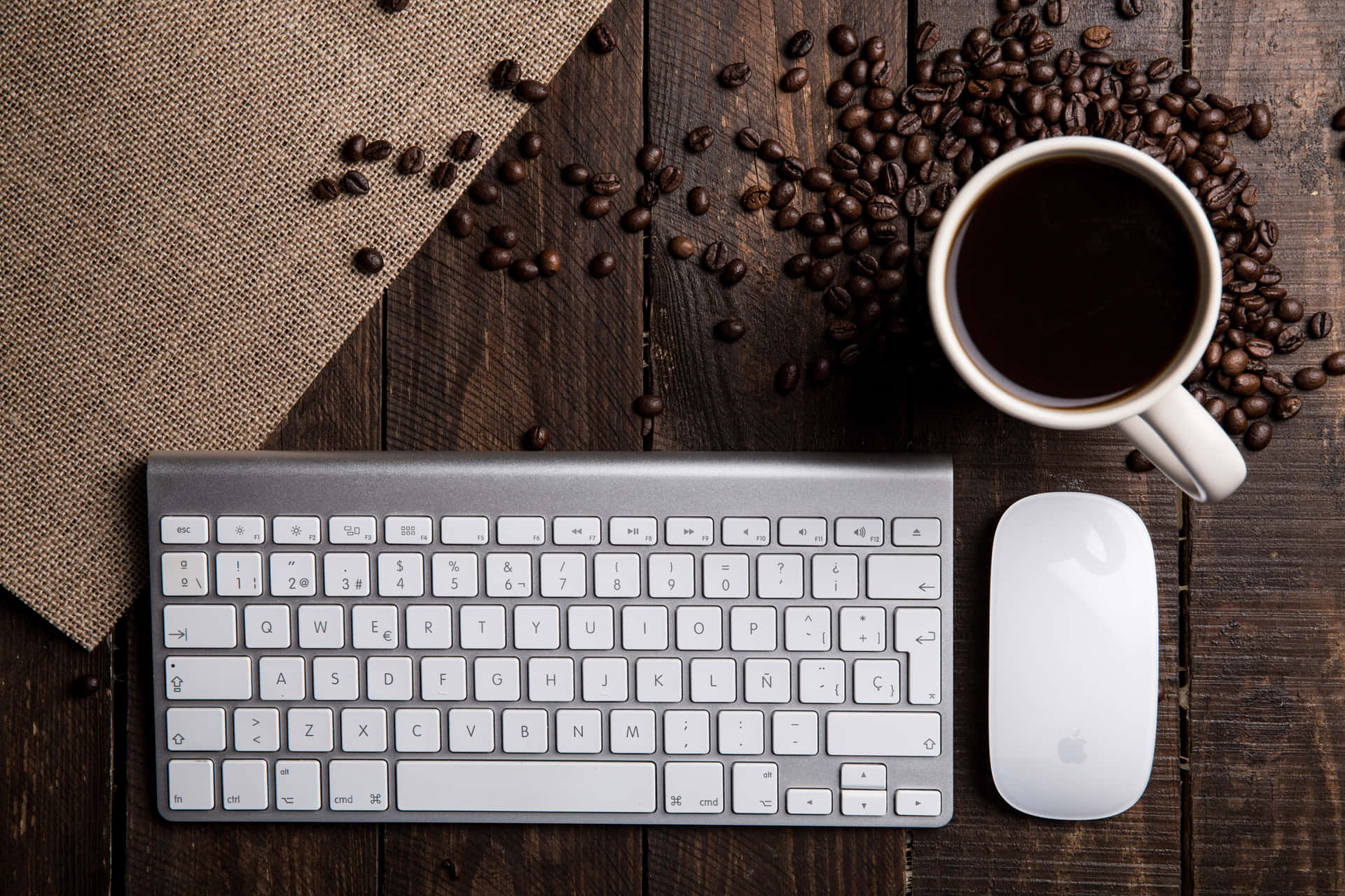 A Cup Of Coffee On A Wooden Table Wallpaper