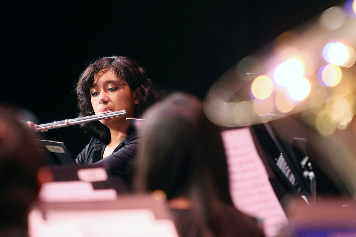 A student playing a flute.