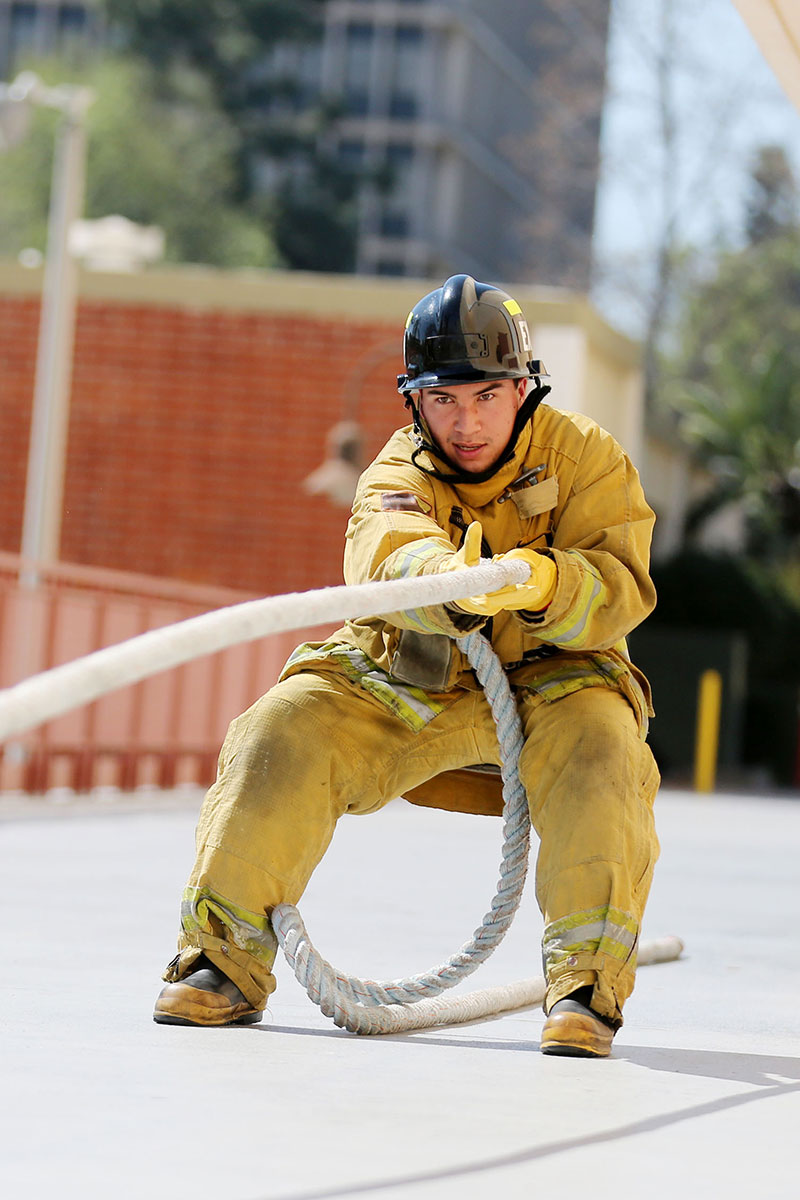 A student fire fighter training.