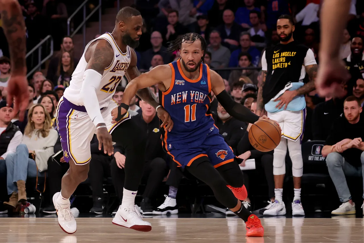 New York Knicks guard Jalen Brunson (11) drives to the basket against Los Angeles Lakers forward LeBron James (23) during the fourth quarter at Madison Square Garden.