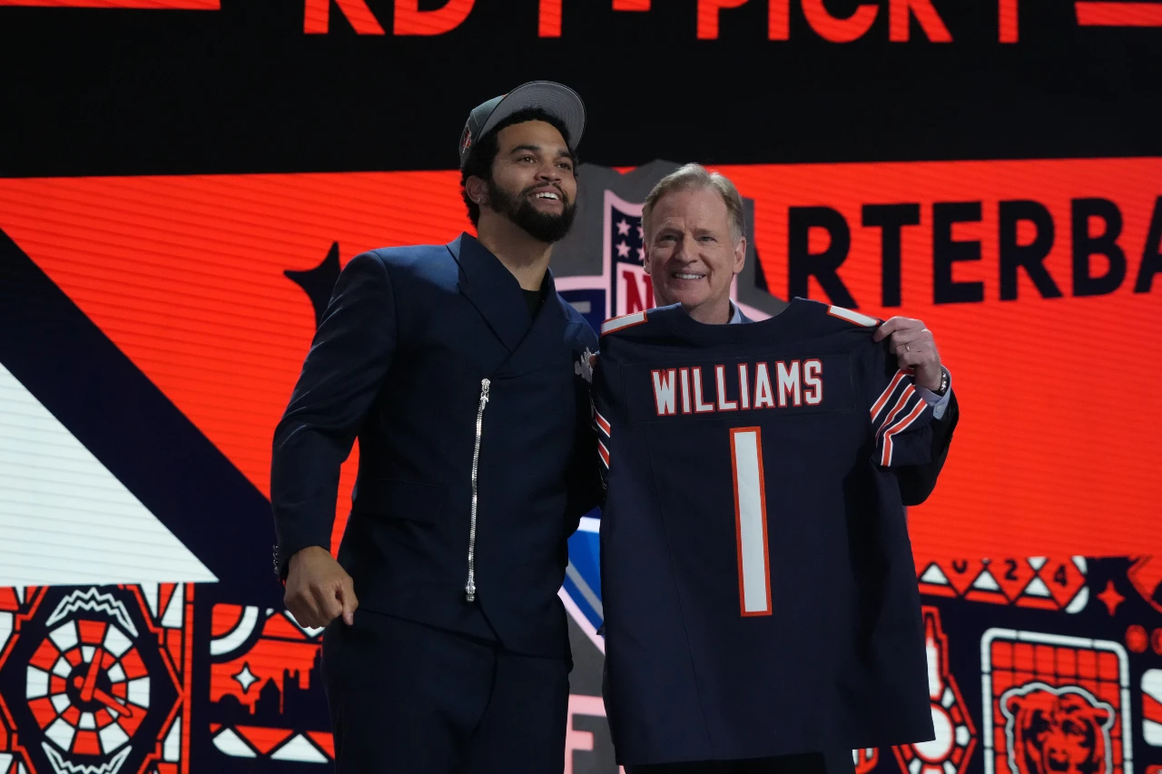 Caleb Williams poses with NFL commissioner Roger Goodell after being selected by the Chicago Bears as the No. 1 pick in the first round of the 2024 NFL Draft.