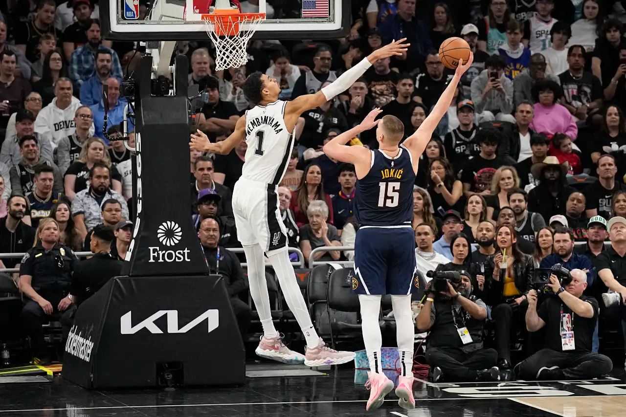 Denver Nuggets center Nikola Jokic (15) shoots over San Antonio Spurs forward Victor Wembanyama (1) during the first half at Moody Center.