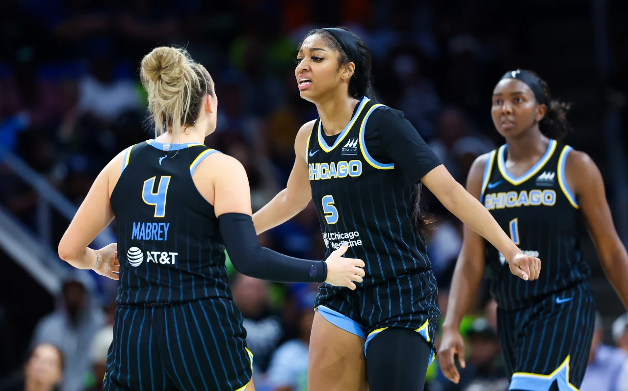 Chicago Sky forward Angel Reese (5) celebrates with Chicago Sky guard Marina Mabrey (4) during the second half against the Dallas Wings at College Park Center.