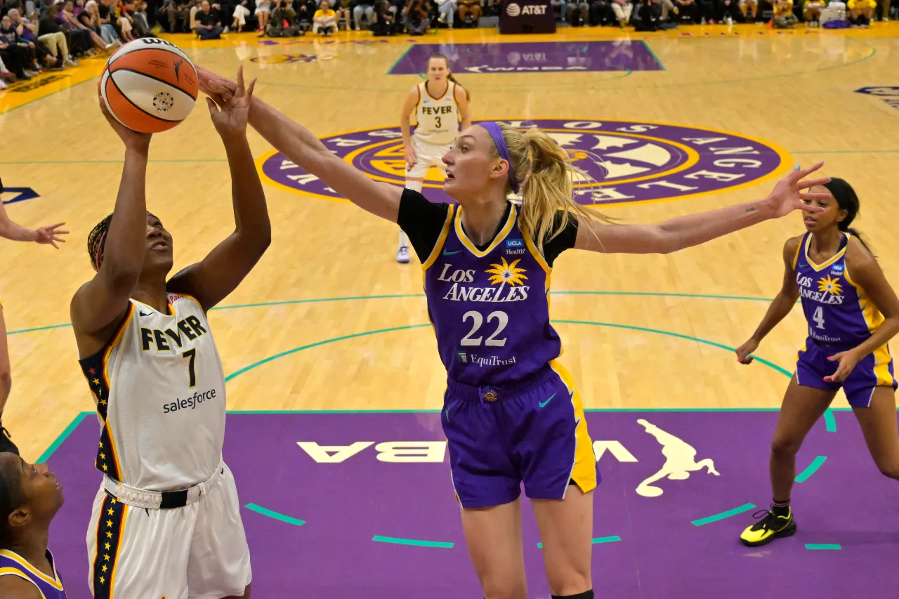 Los Angeles Sparks forward Cameron Brink (22) blocks a shot by Indiana Fever forward Aliyah Boston (7) in the first half at Crypto.com Arena.