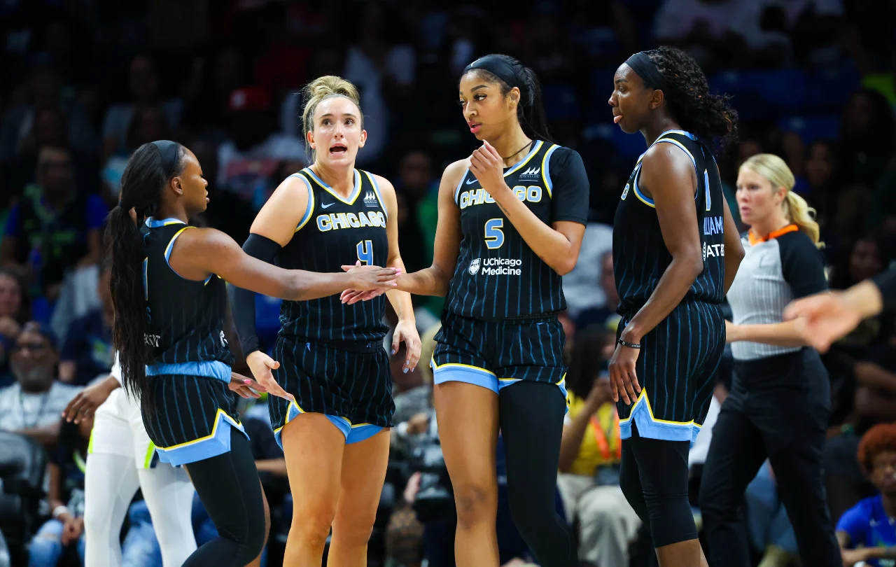 Chicago Sky forward Angel Reese (5) celebrates with Chicago Sky guard Dana Evans (11) and Chicago Sky guard Marina Mabrey (4) and Chicago Sky center Elizabeth Williams (1) during the first quarter against the Dallas Wings at College Park Center.