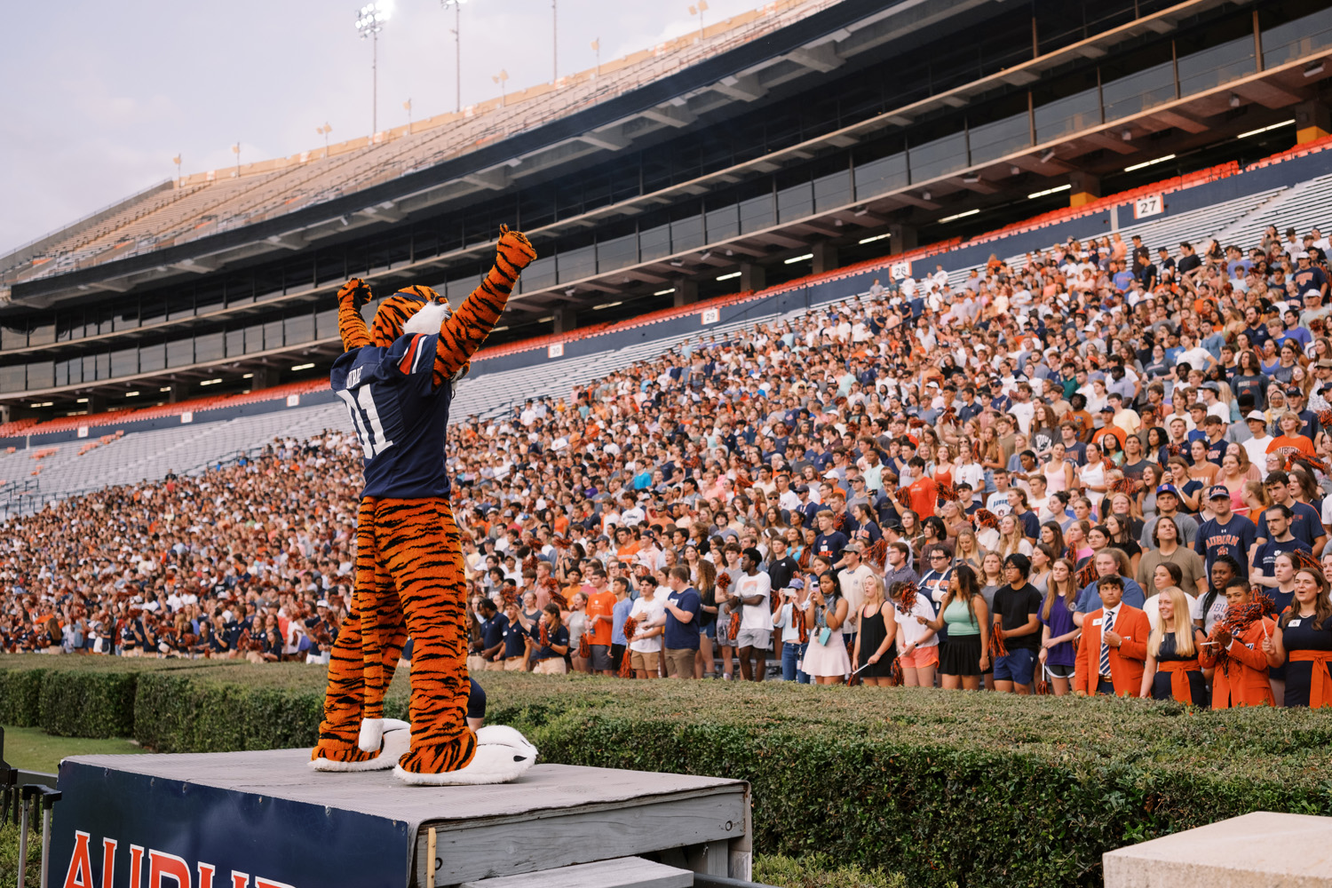 Aubie standing in front of a crowd of students in Jordan-Hare stadium