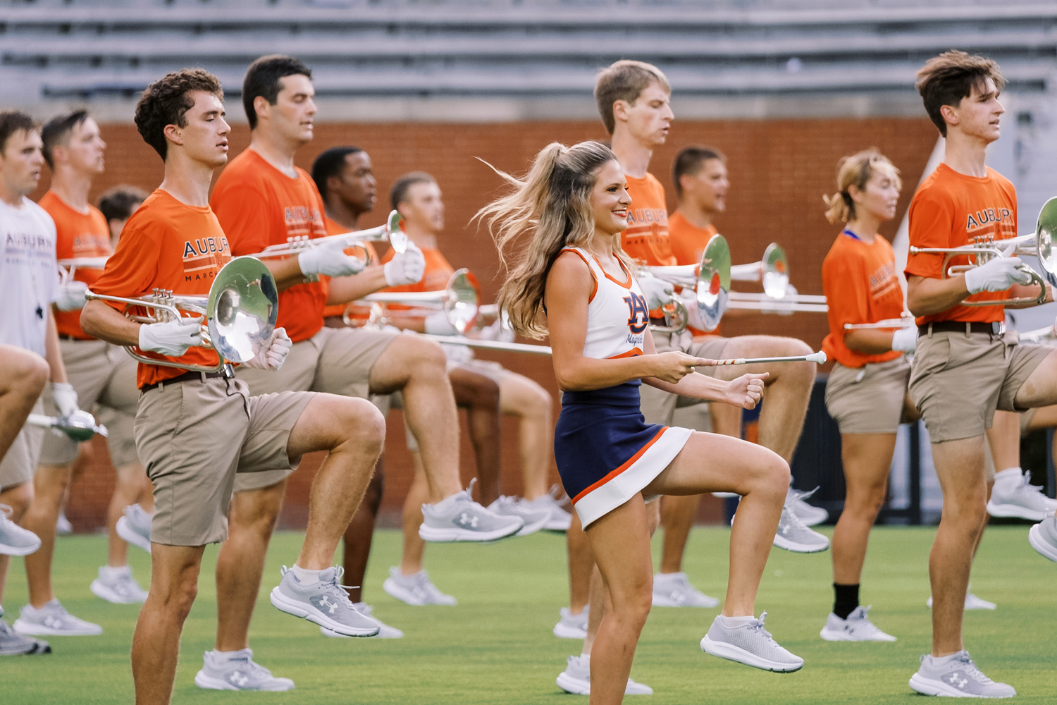 Members of the Auburn University Marching Band performing on Pat Dye field