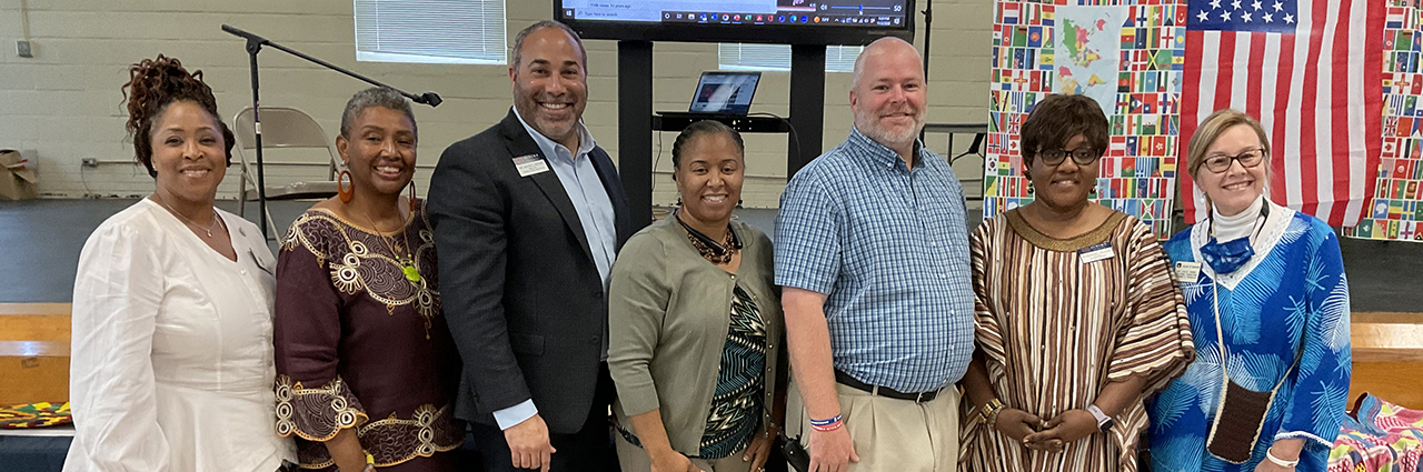 Dr. Elizabeth I. Quansah and Dr. Venus Hewing presenting Outreach Global portfolio to the principal of Lafayette High School.