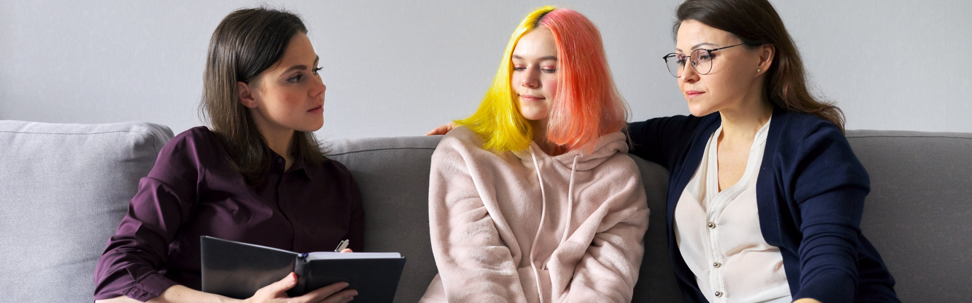 a group of women sitting on a couch