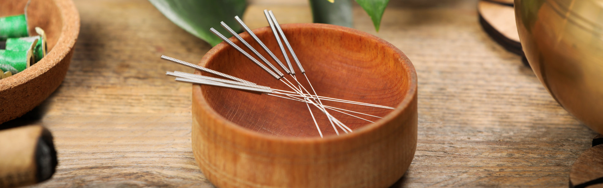 needles in a bowl on a table