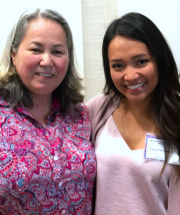 Two embraced women smiling