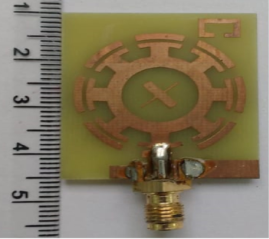 A CIRCULARLY POLARIZED QUAD-BAND ANNULAR RING ANTENNA WITH ASYMMETRIC GROUND PLANE USING THEORY OF CHARACTERISTIC MODES