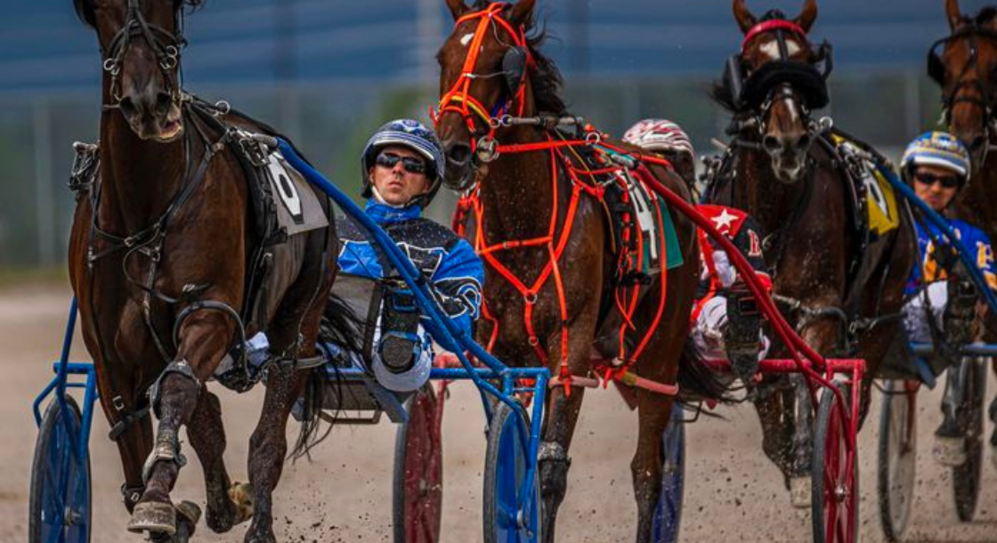 Three horsemen racing with three horses with red and blue wheels