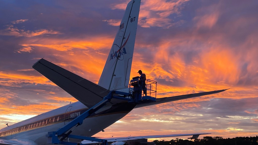 NASA’s DC-8 airborne laboratory is inspected and secured for the night at Cecil Field in Jacksonville, Florida.