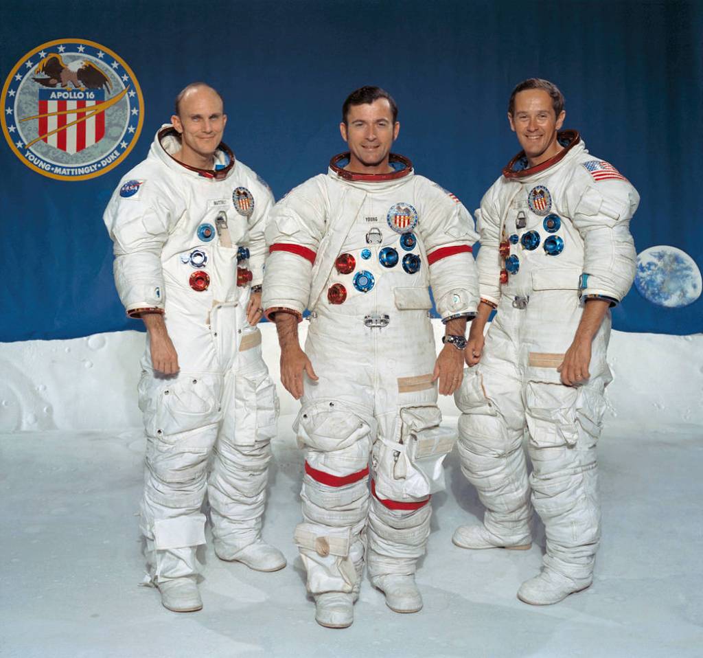 Crew portrat of three astronauts in spacesuits