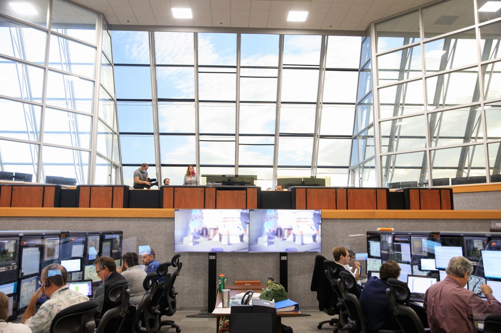 The Artemis I launch team sits inside Firing Room 1 of the Launch Control Center at NASA's Kennedy Space Center in Florida.