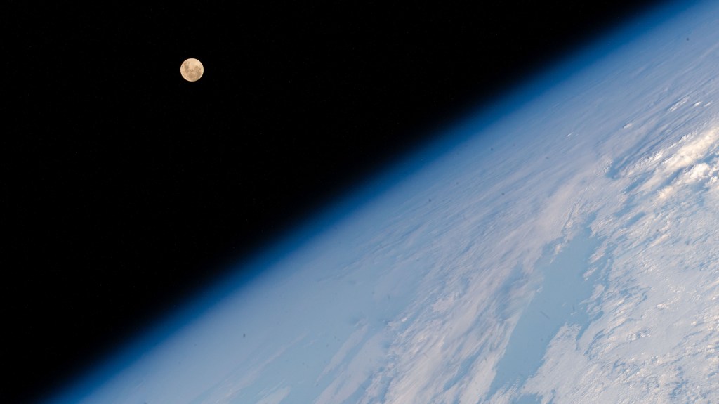 The Full Moon pictured above Earth's horizon as the International Space Station soared 262 miles above the Indian Ocean south of the African island nation of Madagascar.