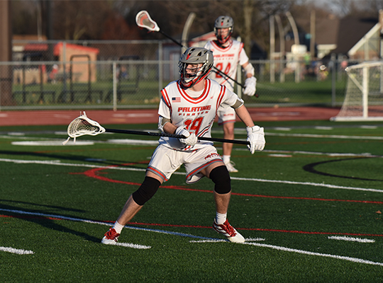 Isaac Menning playing lacrosse