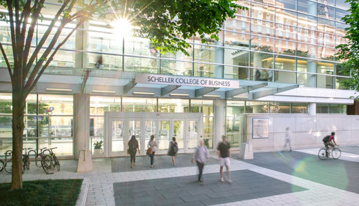 Georgia Tech students, faculty, and staff mill around the Scheller College of Business on campus in Atlanta.