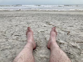 A selfie of my legs on a sandy beach. Instead of looking glamorous, it likes a dead body washed up.