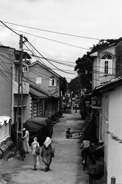 Women entering street in old city