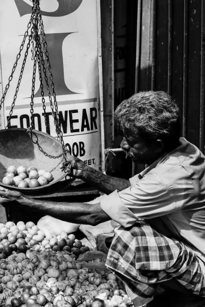 Man weighing with weighing scale