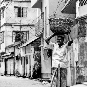 Man putting basket on head