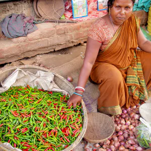 Woman selling chili peppers