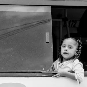 Girl leaning out from car window