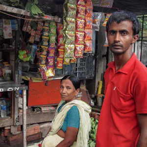 Man and woman wearing a saree in stall