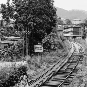 Woman walking on railway track