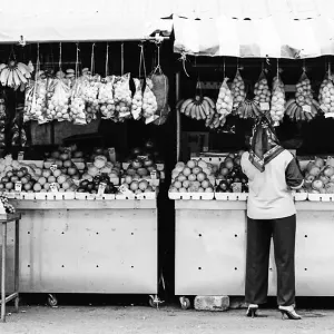 Woman working in fruit shop