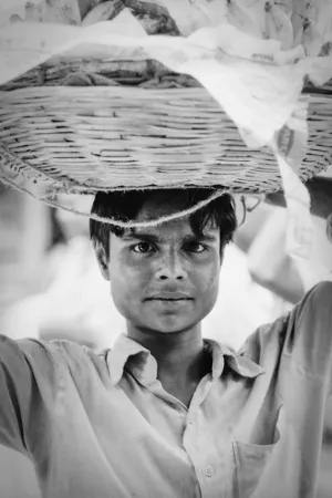 Young man carrying bananas