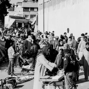 Woman buying at stall