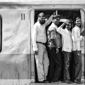 passengers on train coming to Chhatrapati Shivaji Terminus