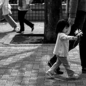 Girl walking with flower