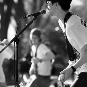 Man singing on sidewalk