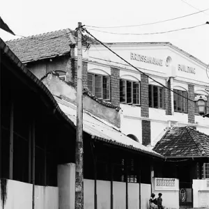 Figures sitting at the end of the street