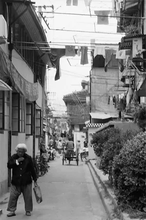 Older woman walking under laundries