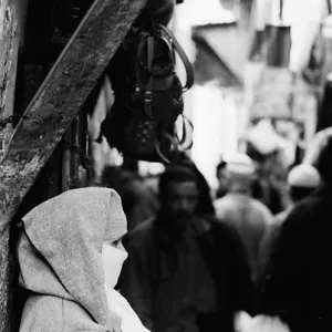 Woman standing in street corner