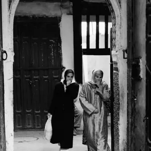 Woman appearing from gate