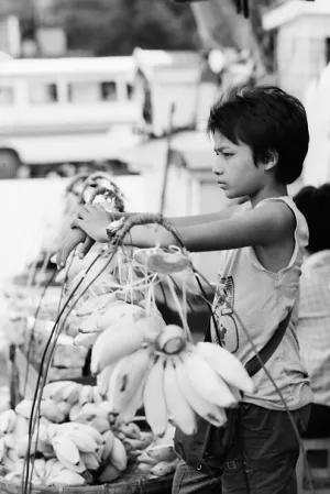 Boy selling bananas