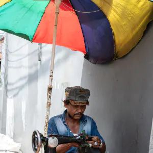 Sewing machine under a parasol parasol