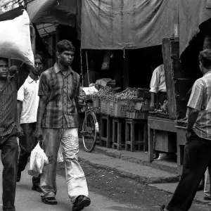 Man carrying many burdens alone